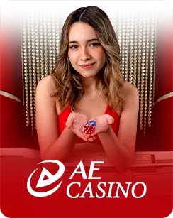 A female live dealer in a red dress smiling while holding dice, with a red and gold casino backdrop and the AE Casino logo at the bottom.